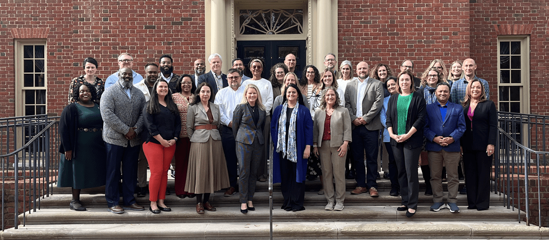 The 2025 Executive Leadership Institute cohort on the steps of a university building