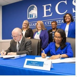 College of the Albemarle President Dr. Robert Wynegar, seated left, joined ECSU Chancellor Dr. Karrie Dixon in signing two agreements. The purpose of the agreements is to build a relationship between the two institutions, and create a clear pathway for COA students to transfer to ECSU.