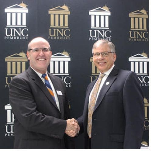 Southeastern Community College President Anthony J. Clarke, left, and UNCP Chancellor Robin Gary Cummings recently signed a BraveStep agreement between the two institutions.