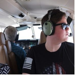 Landon Casstevens ’20 rides in the rear-facing back seat while commercial pilot Louis Panuski instructs Tristan Hostak '20 (in the seat behind Landon, not shown in photo).