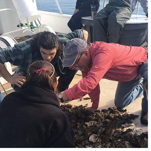 Dr. Steve Hageman, center, on the deck of the University of North Carolina Institute of Marine Science’s research vessel with his paleontology students from Appalachian State University in the spring of 2018. Hageman and the team examined invertebrate organisms dredged from the seafloor near Atlantic Beach and Morehead City. Photo submitted