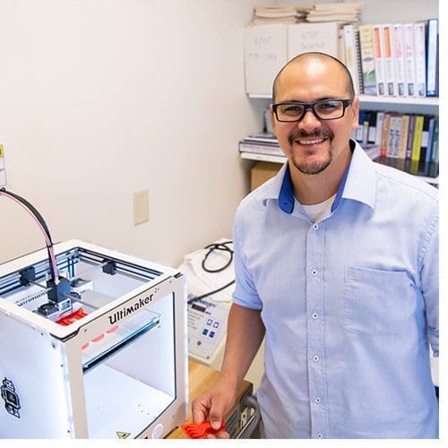 Diego Herrera, a graduate student in the occupational therapy program, is researching 3D printing this summer with Assistant Professor Elizabeth Fain.