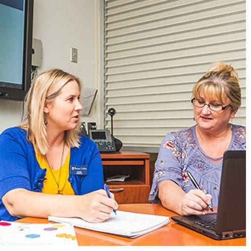BIPS coaches Leah Tompkins (left) and Angi Kinsey (right) work virtually with students on a regular basis to keep them on track for graduation.