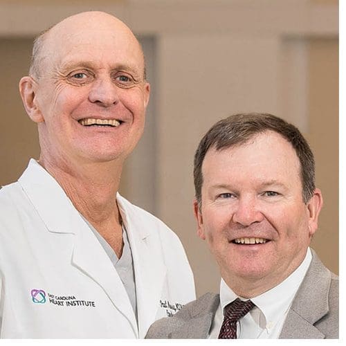 From left, Dr. Paul Mounsey, ECU's new chief of cardiac electrophysiology and ECU cardiac surgeon Dr. Andy Kiser are part of the new atrial fibrillation management team at ECHI (Photos by Cliff Hollis)