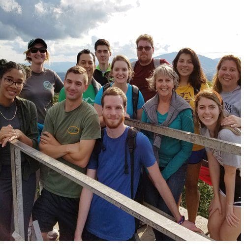 Director of Transfer Services Jane Rex joins the transfer residential learning community for a hike to the fire tower on Flat Top Mountain near Boone.