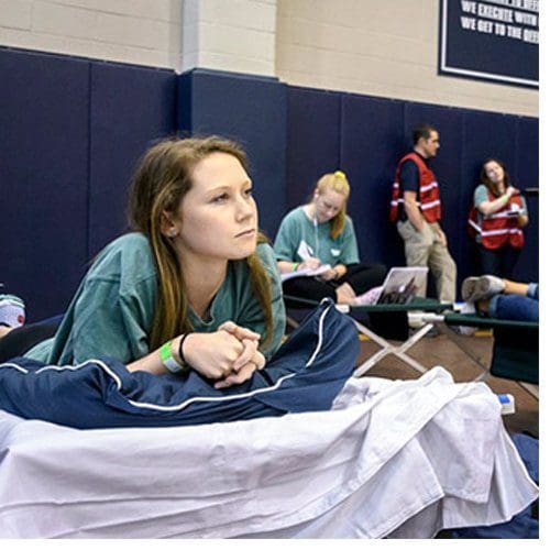UNCW students participate in the full-scale hurricane evacuation exercise at UNCG's Coleman Practice Gymnasium, which served as the shelter site.