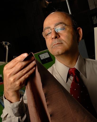 Dr. Behnam Pourdeyhimi examining textiles 