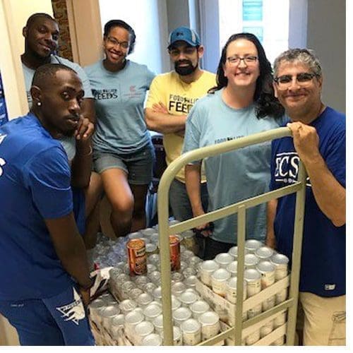 Viking Cares Food Pantry team includes, left to right, Tyrese Bazemore, Demond Holley, Ashante Spruill, Food Lion manager Skylar, Dr. Jennifer Brown and Russ Haddad.