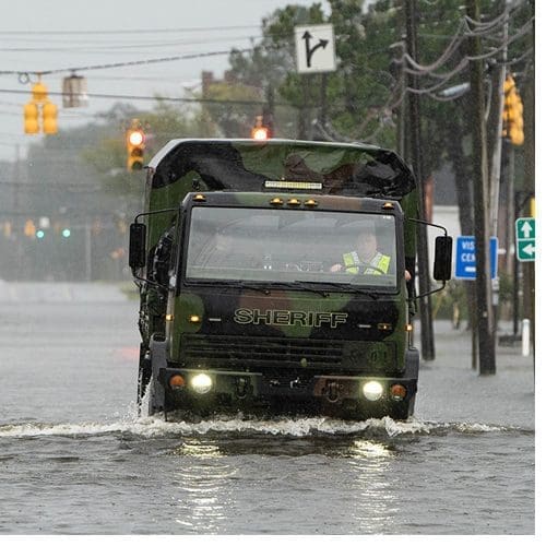 A sheriff's department truck drives on a flooded street in Washington, N.C., after Hurricane Florence. (Photo by Cliff Hollis)