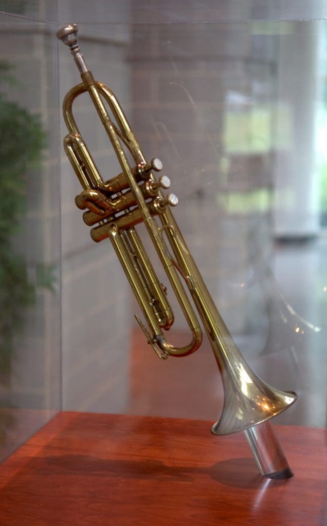 Trumpet on display in a case