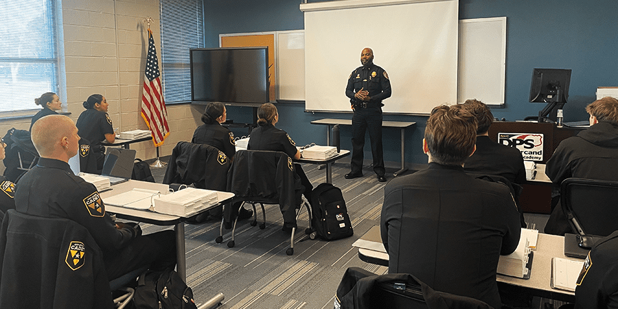 Police cadets seated in a classroom for law enforcement training