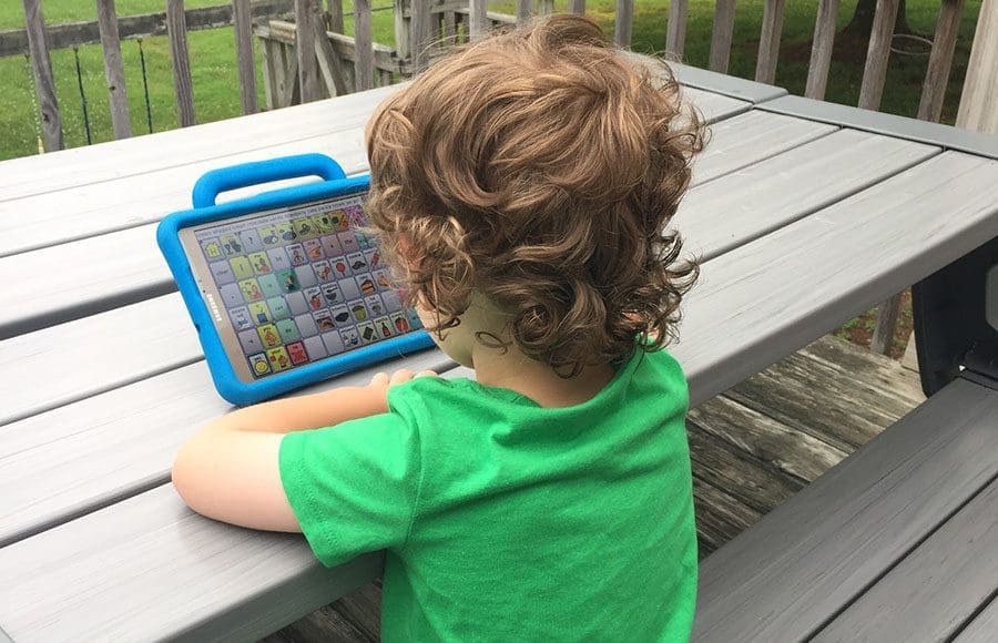 3-year-old uses an augmentative and alternative communication (AAC) device